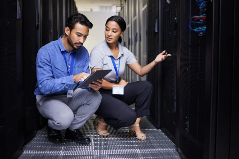 a man and woman in a server room