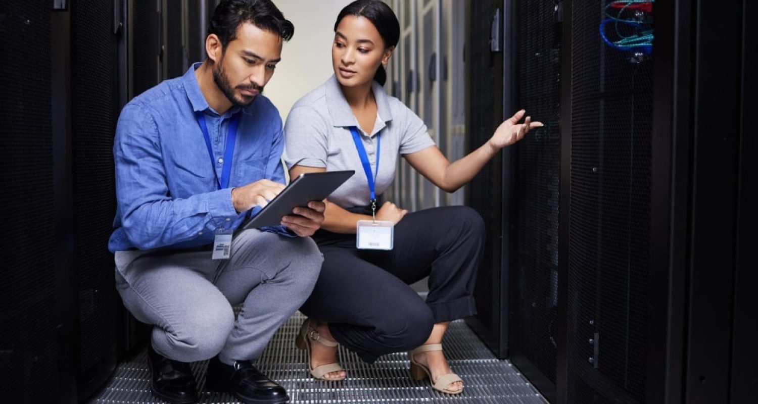 a man and woman in a server room