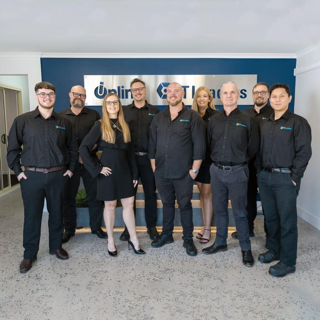 The IT Leaders team standing in the foyer of their Gold Coast headquarters.