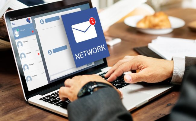 someone using a laptop looking at an email